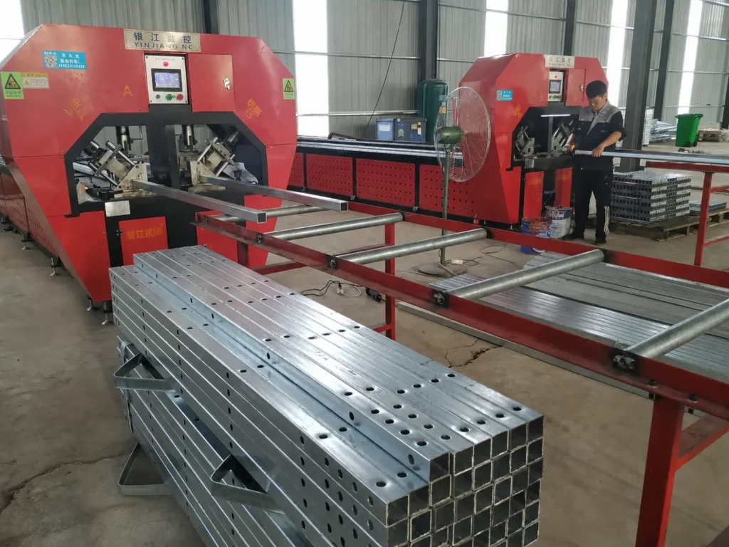Automatic tube punching machine working in factory